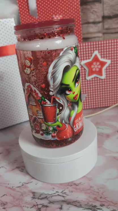 Détail paillettes rouges et reflets holographiques en mouvement dans verre Snowglobe plastique